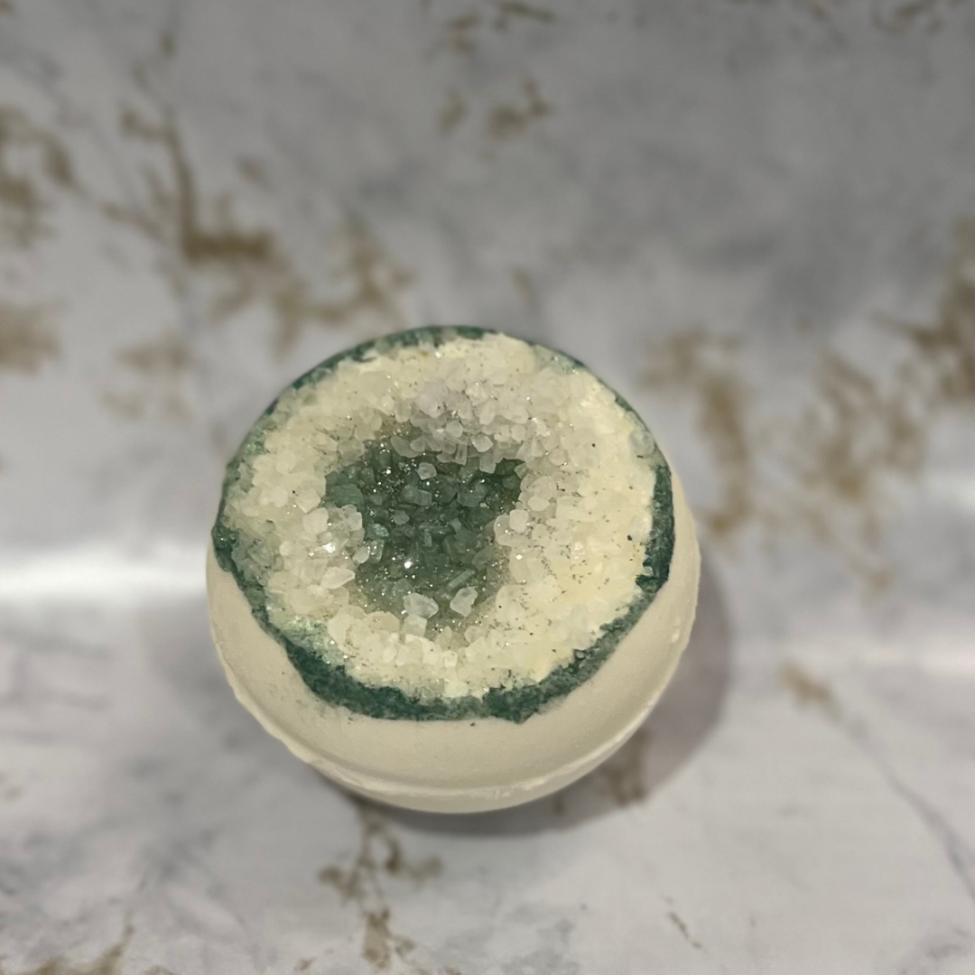 Green Geode bath bomb  on a marble surface