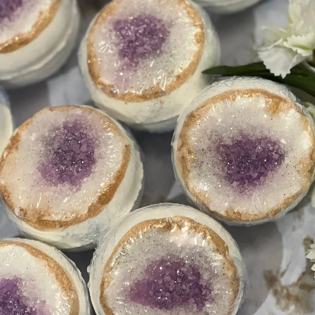 Close-up of bath bombs with purple centers.